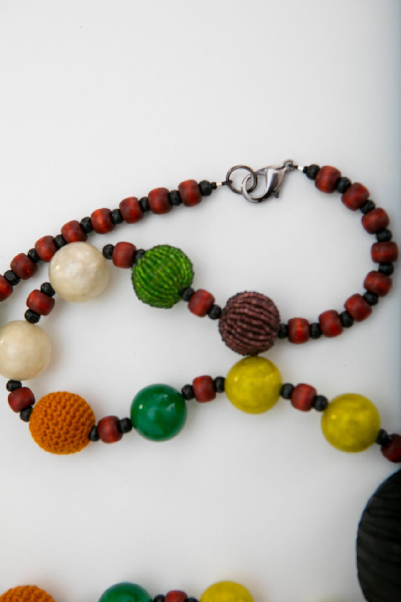 Long Wood Mask Necklace with Yellow, Green and Orange Beads | Hopetown & Hunter